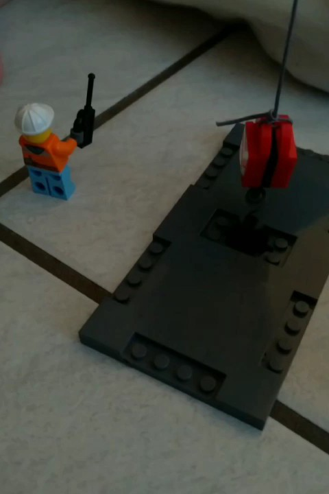 Lego Figur mit Kran